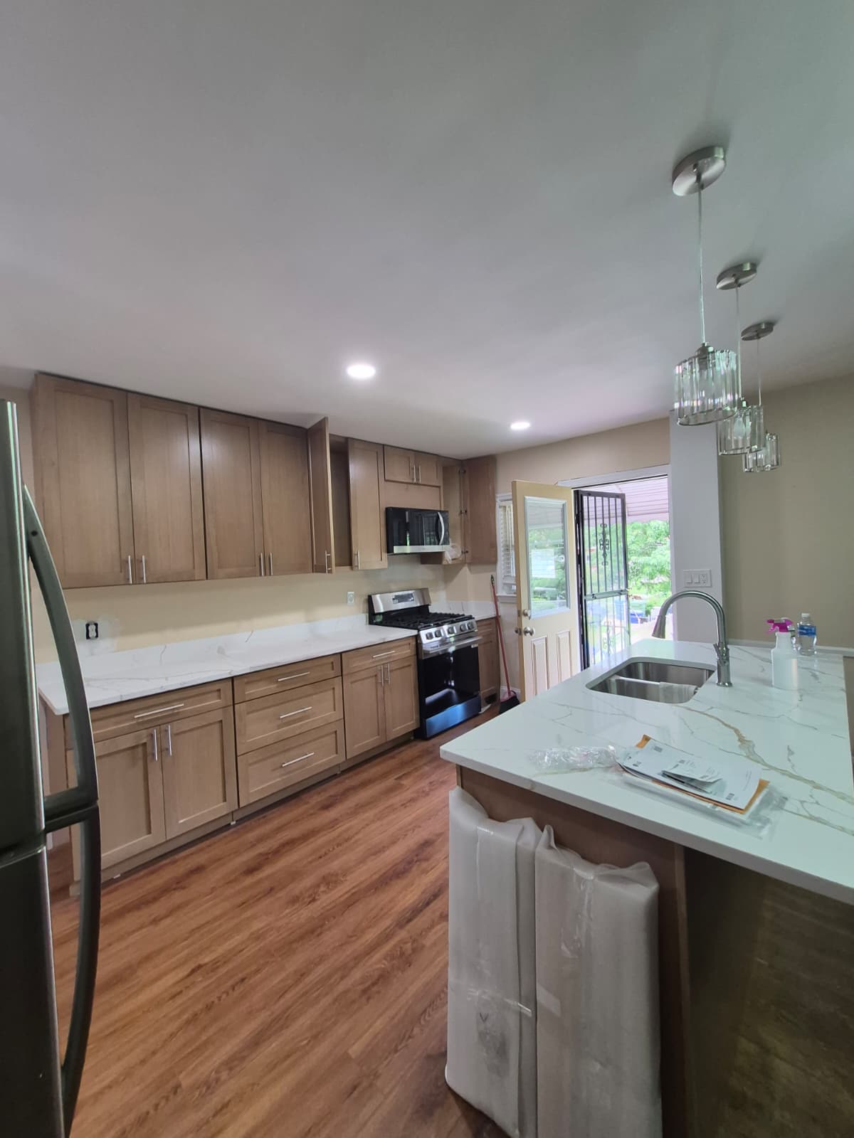 Kitchen after renovation — new cabinets and countertop