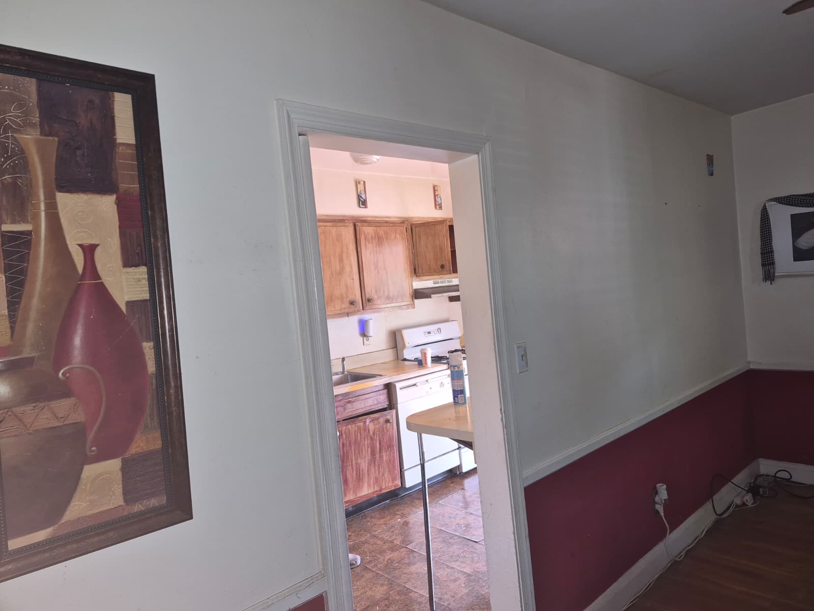 Kitchen before renovation — old cabinets and flooring