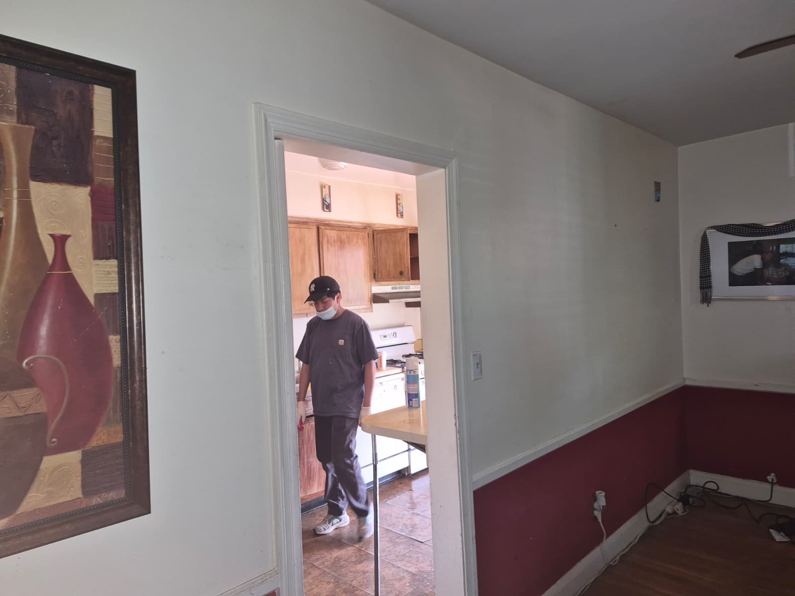 Kitchen before renovation — old cabinets and flooring