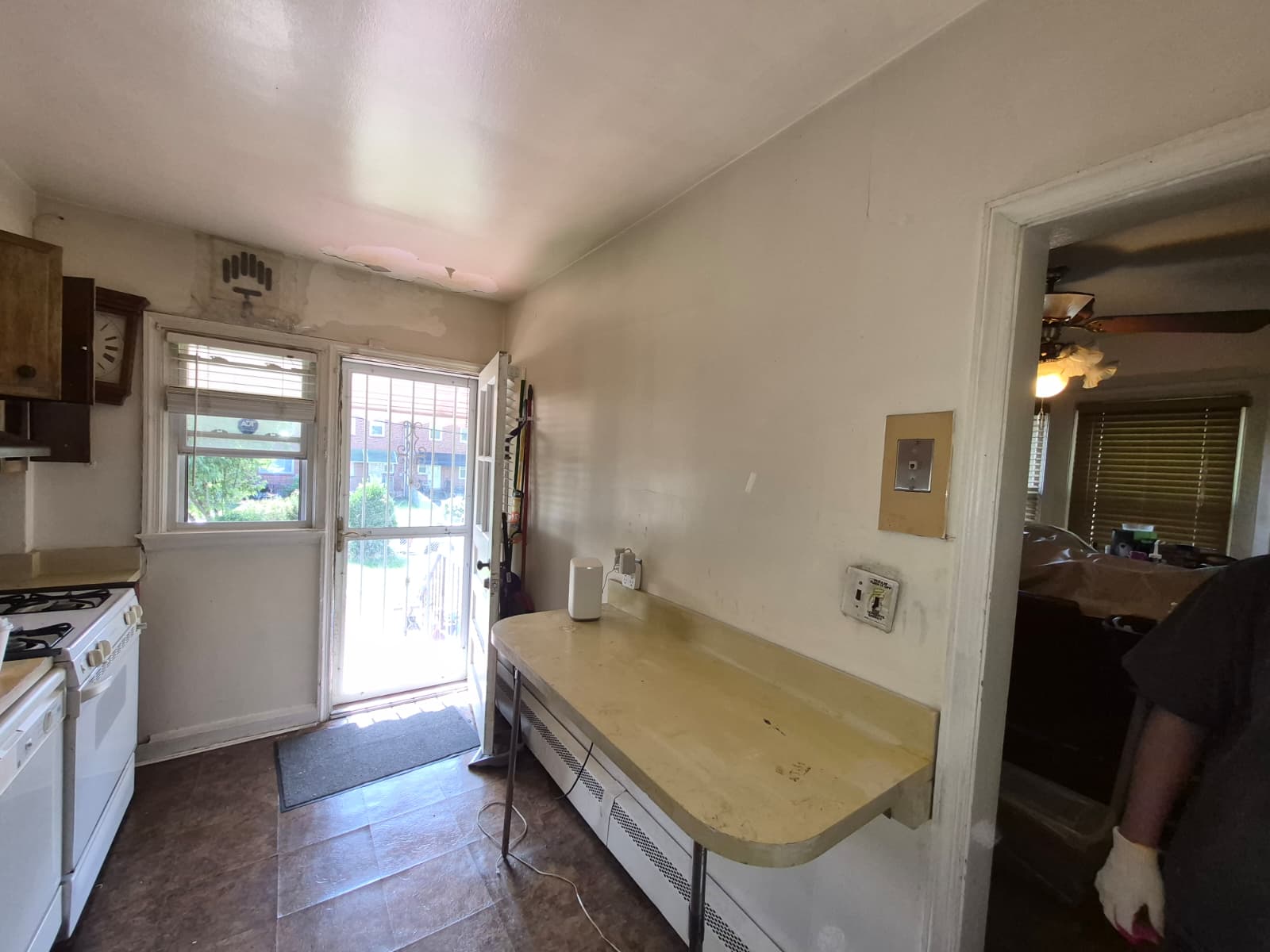 Kitchen before renovation — old cabinets and flooring