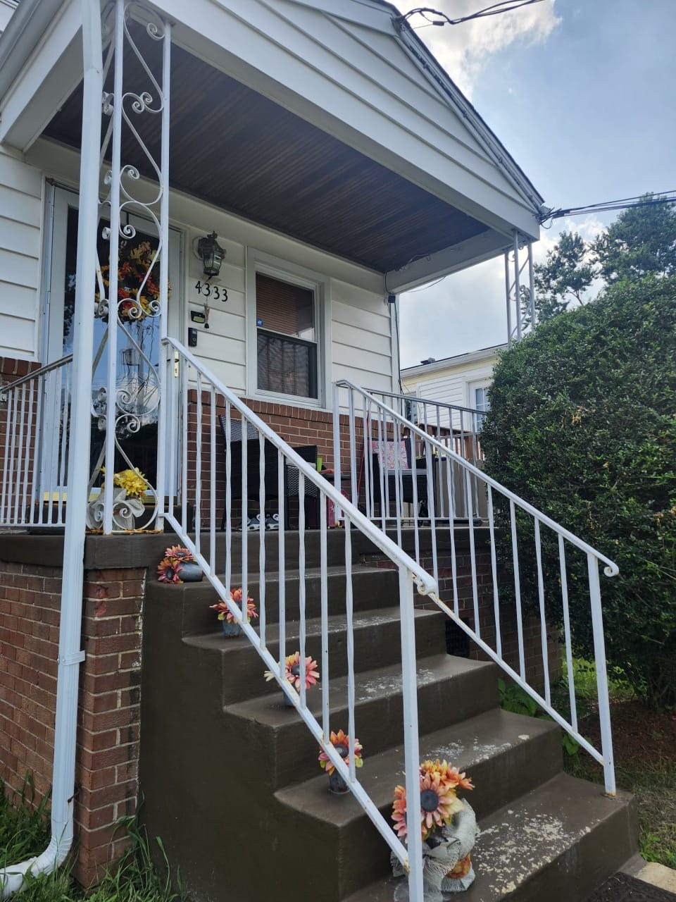 Exterior renovation — new siding, porch, and steps