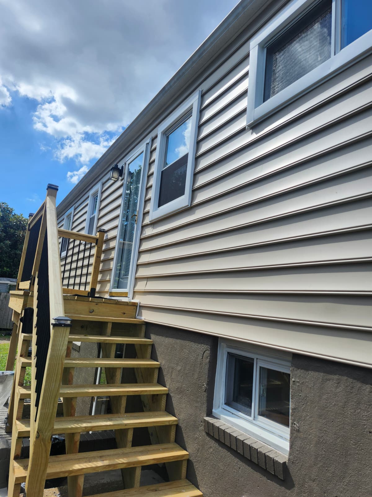 Exterior renovation — new siding, porch, and steps