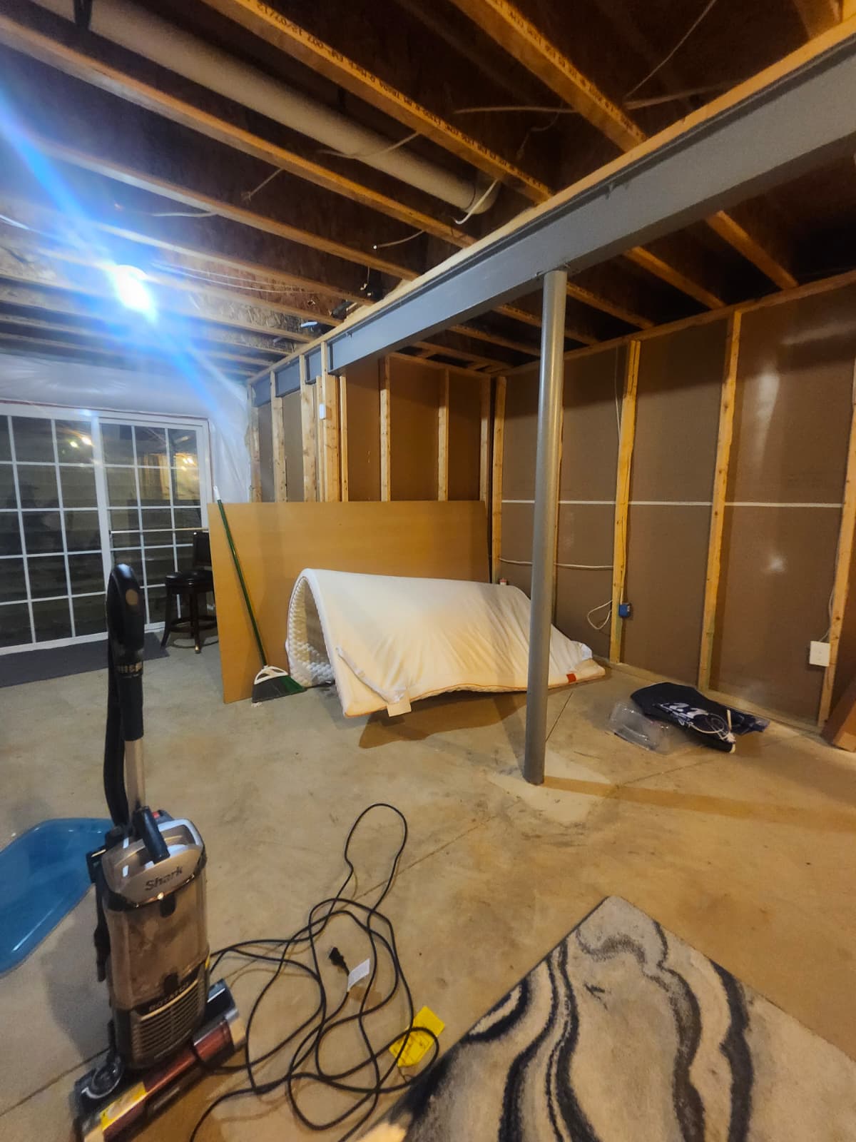 Basement bathroom before renovation — unfinished framing